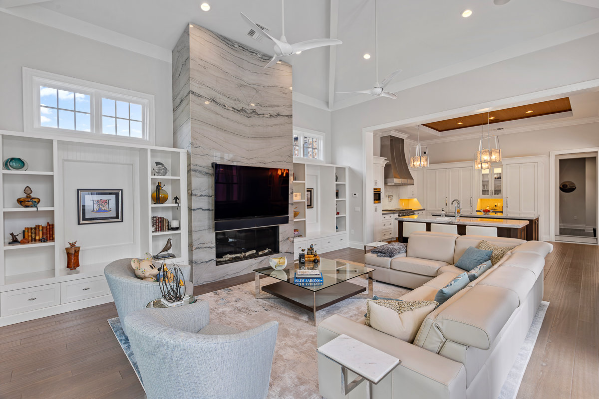 living room with white furniture and large tv